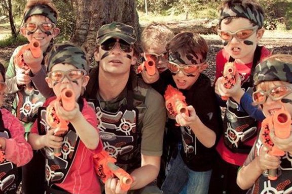 A kid enjoying laser tag on the weekend