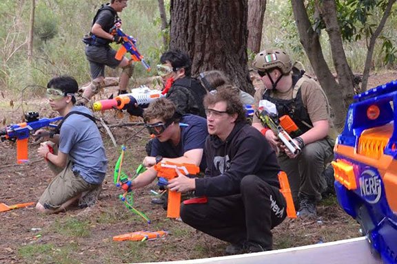 A kid enjoying laser tag on the weekend